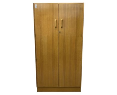 E. Gomme for G-Plan - 'Brandon' light oak double wardrobe, the interior fitted with hanging rail and shelves Dimensions: Heig