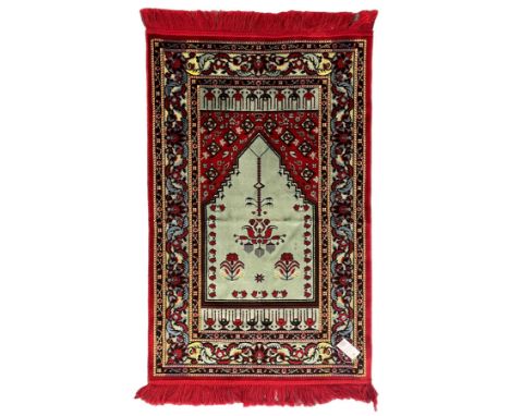 Turkish crimson and light blue ground prayer rug, the field decorated with stylised plant motifs, scrolling foliage pattern b