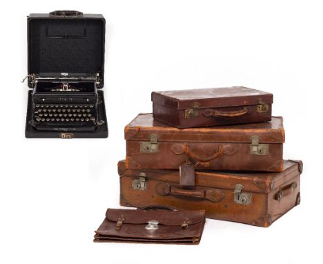 A LEATHER SUITCASE 72cm wide together with two further smaller leather suitcases, a leather satchel and a Royal typewriter Co