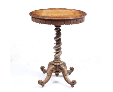 A VICTORIAN SATINWOOD OVAL OCCASIONAL TABLE with carved frieze, barley twist column support and four scrolling legs terminati