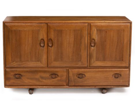 AN ERCOL LIGHT ELM SIDEBOARD CABINET with three doors above two drawers, 129cm wide x 44cm deep x 77cm high Condition: surfac