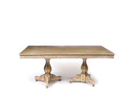 A RECTANGULAR PAINTED AND PARCEL GILT DINING TABLE with twin pedestal supports, with faceted columns, decorative painted deco