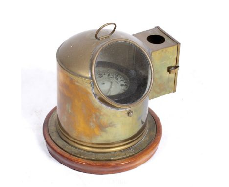 A GIMBALED SEA COMPASS in a brass surround with an oil lamp fitting, 25cm wide x 25cm high Condition: internal water level lo