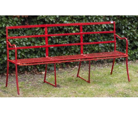 A RED PAINTED WROUGHT IRON GARDEN BENCH 167cm wide x 82.5cm deep Condition: seemingly recently repainted, additional bar fixe