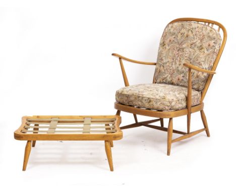 AN ERCOL LIGHT ELM SPINDLE BACK ARMCHAIR 70cm wide x 68cm deep x 90cm high with a matching footstool Condition: surface marks