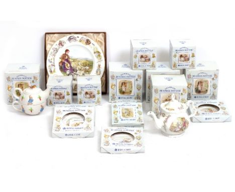 A COLLECTION OF ROYAL ALBERT BEATRIX POTTER RELATED CERAMICS consisting of four boxed beakers, three boxed cups and saucers, 