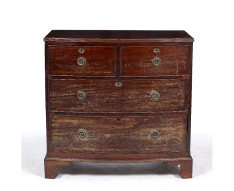 A 19TH CENTURY MAHOGANY BOW FRONTED CHEST OF TWO SHORT AND TWO LONG DRAWERS standing on bracket feet, 88cm wide x 52cm deep x