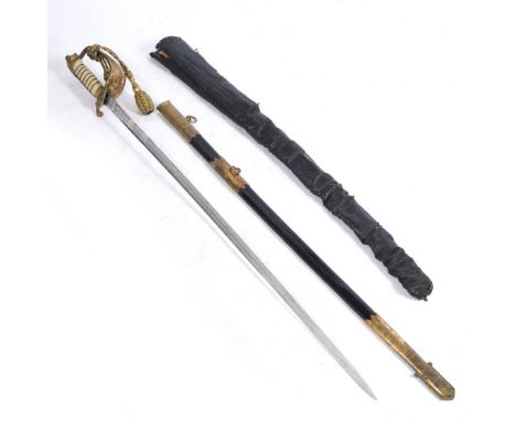 A ROYAL NAVAL OFFICERS SWORD with a lion's head pommel, fish skin grip, etched blade marked J R Gaunt with a leather and bras