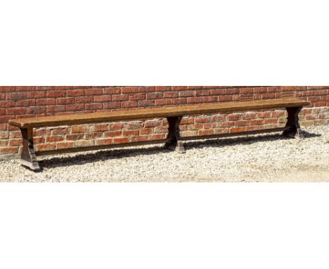 A VICTORIAN OAK LONG BENCH with shaped supports united by stretchers, approximately 366cm long x 34cm deep x 45cm high Condit