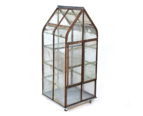 A WROUGHT IRON GLAZED MINIATURE GREEN HOUSE OR FERN HOUSE with twin doors to the front and single shelf within, the zinc plat