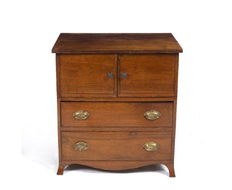 A SMALL MAHOGANY LOW CABINET with twin cupboard doors over two drawers and on splaying bracket feet, 63.5cm wide x 43cm deep 