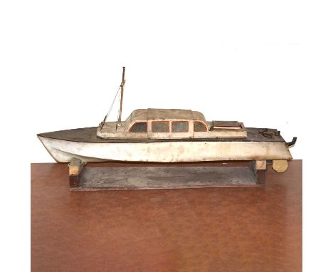 Model boat with stand, metal construction with removable top, fitted with a 15cc petrol engine, length 101cm.