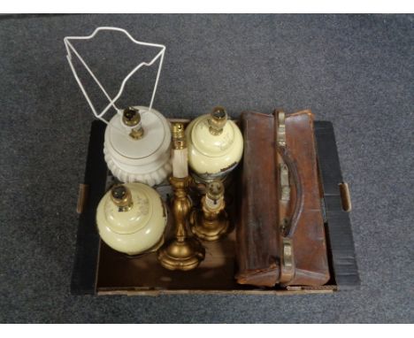 A box of gilt wood table lamps, vintage leather Gladstone bag, three pottery lamps 