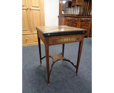 A Victorian inlaid rosewood envelope card table 