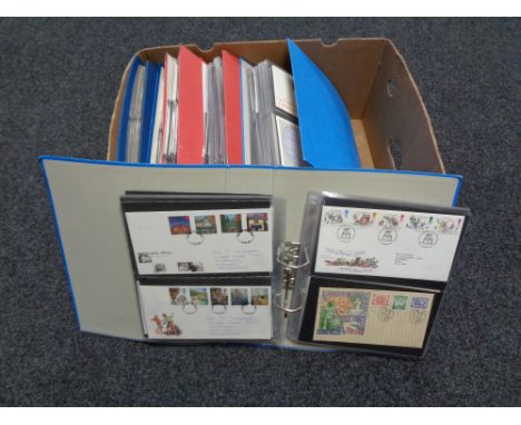 A box of six folders of first day covers 