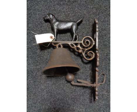 A metal Labrador wall bracket with bell 