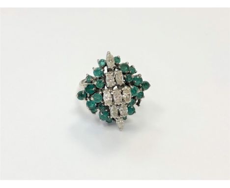 An 18ct gold emerald and diamond cluster ring, size M