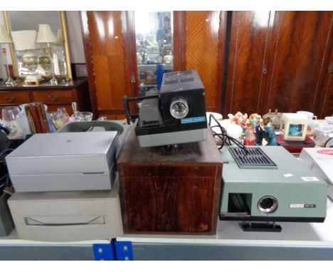 Four vintage projectors to include a Rank Albus in fitted wooden box, Prinz Auto, Rollei and Prestinox 680 auto focus 