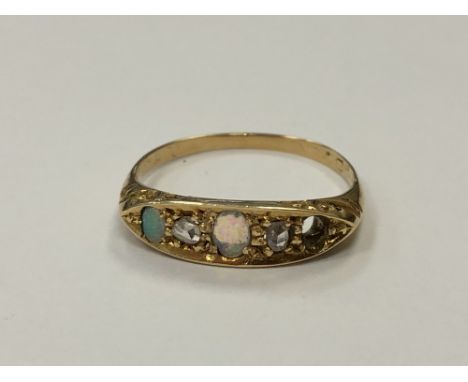 An 18ct gold opal and diamond ring (one opal deficient), size N. CONDITION REPORT: 2.7g