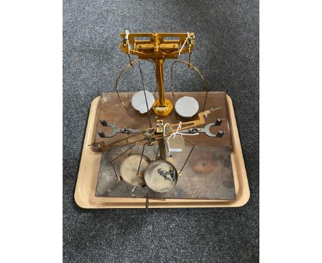 Two sets of Chemist's scales mounted on a board 