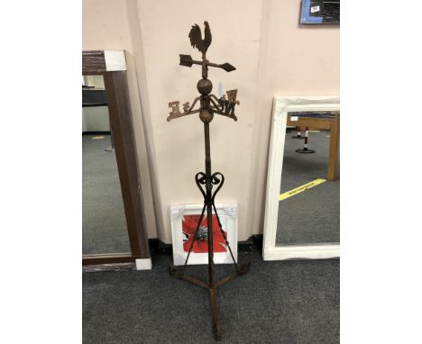 A wrought iron weather vane