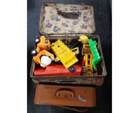 Two vintage luggage cases, toys, tin trunk