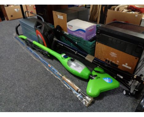 A metal concertina tools box containing hand tools, extension reel, walking sticks, fishing rod and steam mop