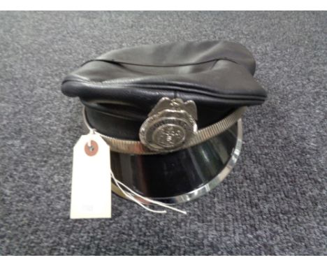 A Mr Hat leather cap bearing a constable badge 
