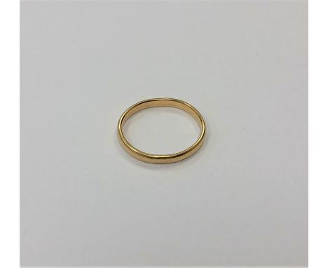 An 18ct gold band ring (misshapen) CONDITION REPORT: 2.2g