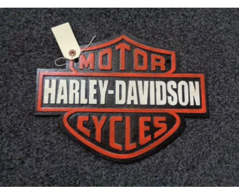 A metal Harley Davidson plaque 