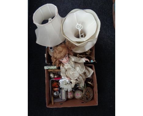 Two boxes of marble and brass table lamps, porcelain doll, trinket boxes, brass trivet etc 