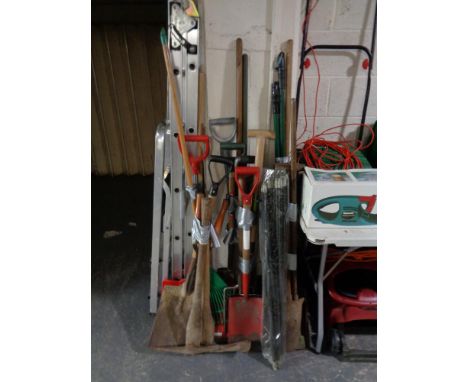 Six bundles of assorted garden tools and a set of drain rods 