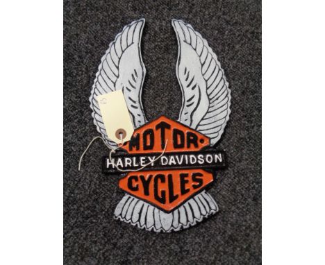 A metal Harley Davidson plaque 