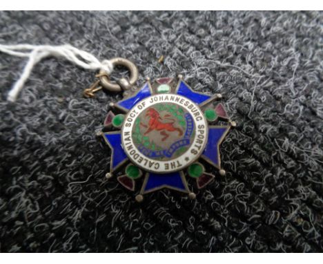 A silver and enamel medal for the Caledonian society of Johannesburg