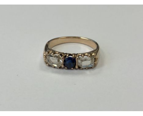 A three stone diamond and sapphire ring, approx. 1 carat total diamond weight