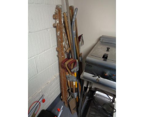 A pair of folding garden steps and four bundles of assorted garden tools 