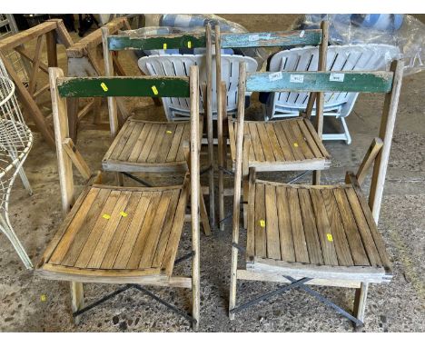 Set of four vintage folding wooden chairs