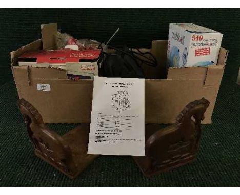 A box of 7 inch portable DVD player, jigsaw, wooden bookends and tool sharpener