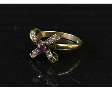 A ruby and seed pearl ring stamped 9ct, 2.8g (NB several seed pearls missing)