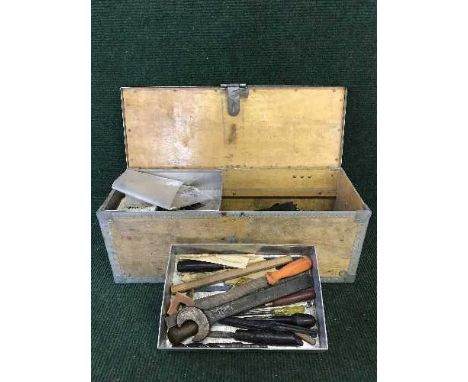 A metal bound tool box and assorted hand tools, drill bits etc 