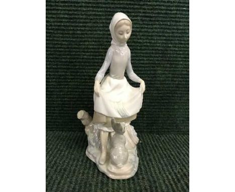 A Lladro figure - girl with rabbit 