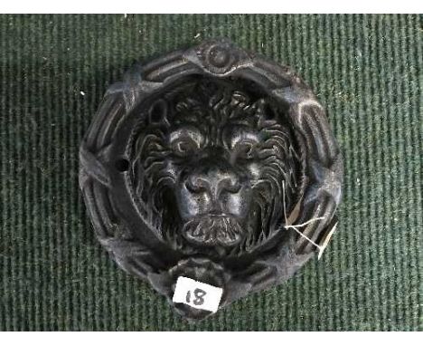 A cast metal Lion mask door knocker