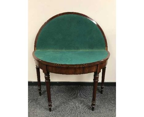 A nineteenth century mahogany d-shaped card table