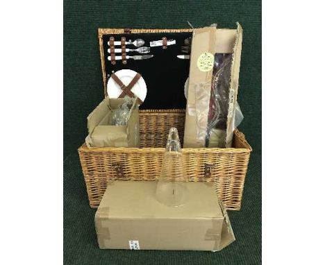 A pine dressing table stool and a picnic hamper containing candle holders 