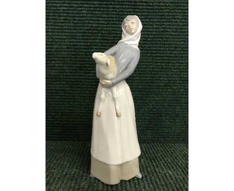 A Lladro figure - girl with lamb 
