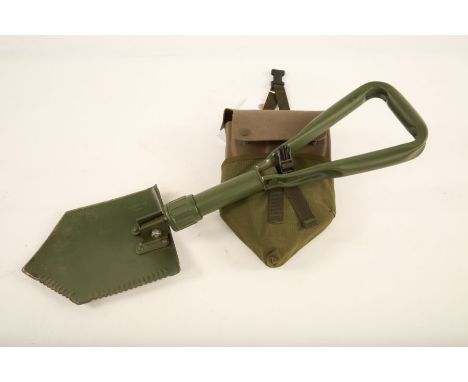 A British Army portable and folding shovel in a green webbing bag


#1449