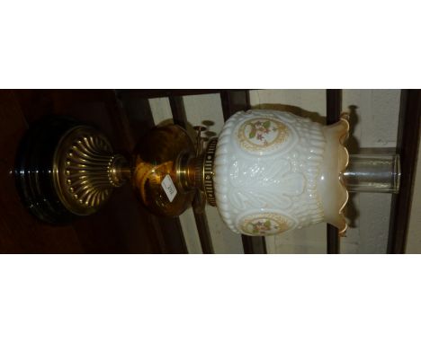 Brass oil lamp with turned base, glass reservoir and shade