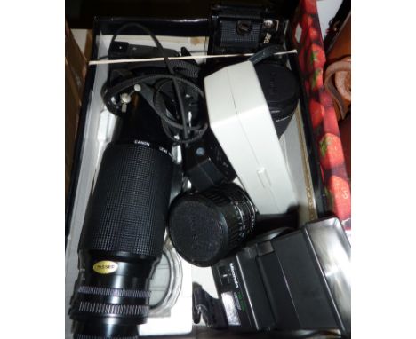 Canon A-1 camera and assorted lenses inc a Zoom Lens FD100-300mm, macro lens, 35-105mm lens, light meters etc