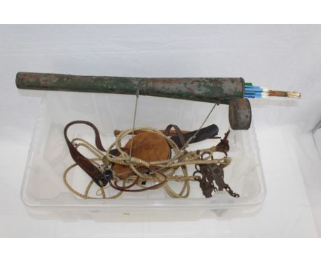 Old bow and arrow, an antique alpine hiking pole, tribal bow, extending tent pole and other tribal items.