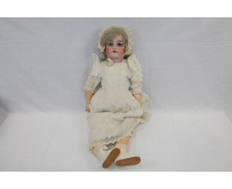 Doll - bisque head marked - K & R, Simon Halbig - blue sleeping eyes, painted brows, lashes and lips, top four teeth showing,